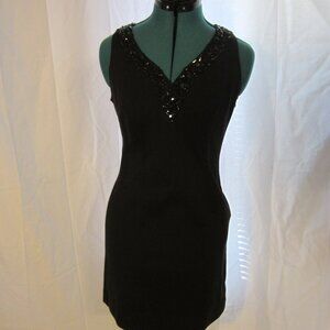 INC Black Dress with black plastic design around v neck, size 6 petite.